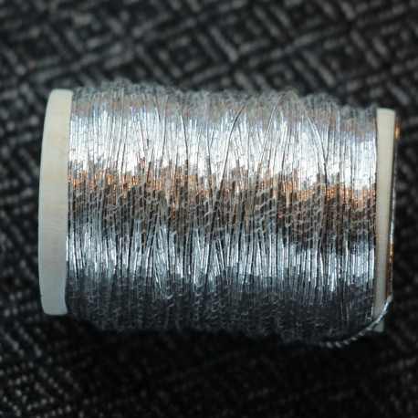 Spun silver on wooden bobbin - 0.5mm